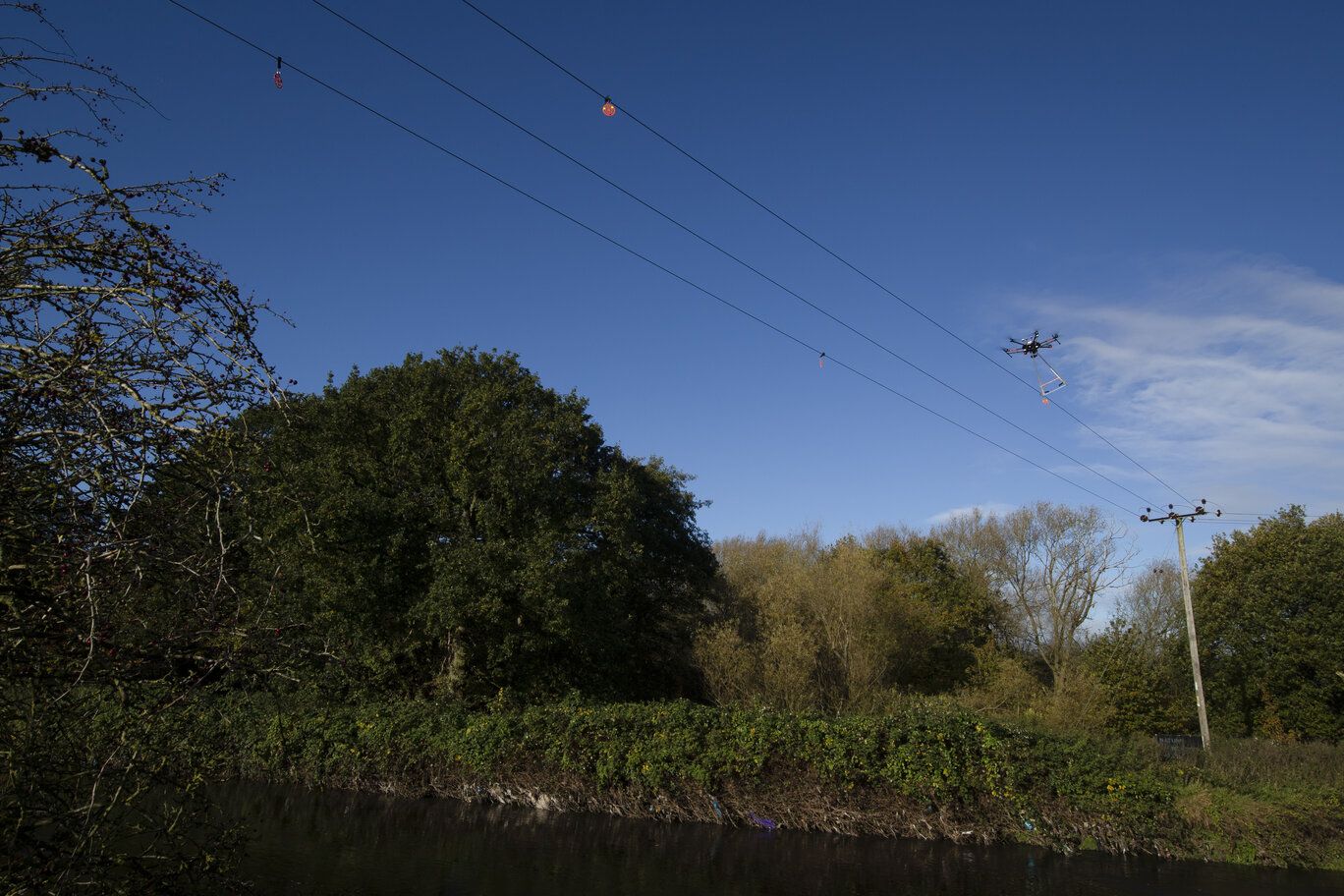 Drone flying near overhead power lines
