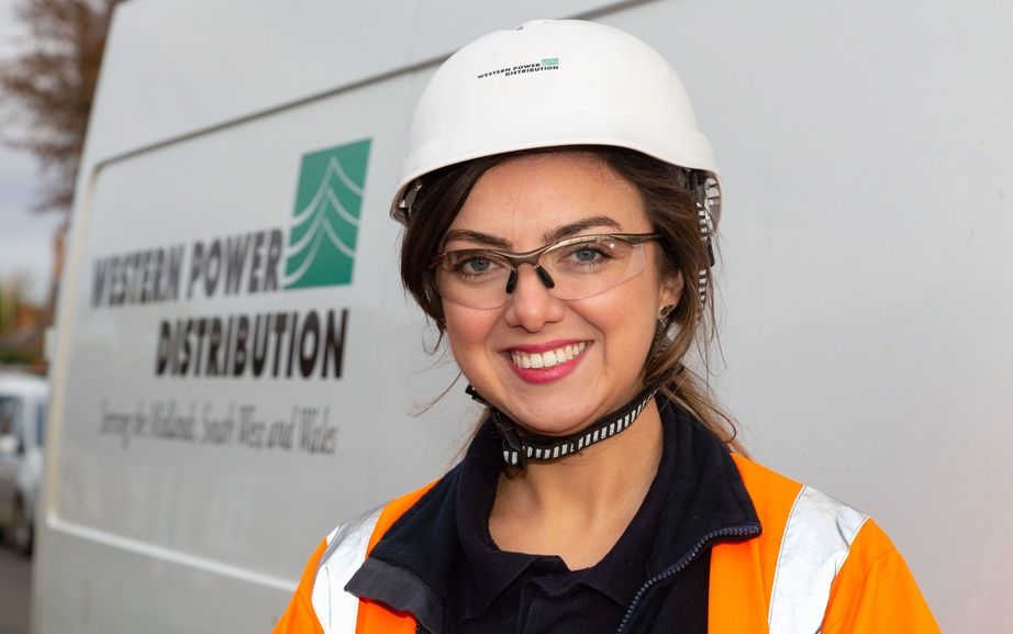 Female engineer in front of Western Power Distribution van